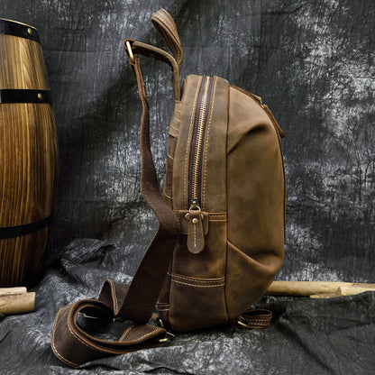 Stylish brown leather large capacity chest bag with multiple compartments and zippers, displayed on a dark textured background.