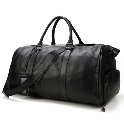 Large black leather business travel bag with multiple compartments and a detachable shoulder strap, designed for functionality and style.