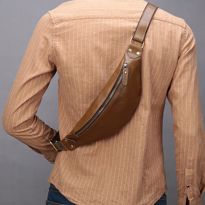 Leather men's cell phone belt bag - Stylish tan-colored leather belt bag with a zippered compartment, attached to the man's outfit in the image.