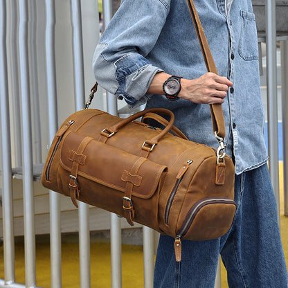 Rugged leather travel bag with large capacity, carried by a man in casual denim outfit