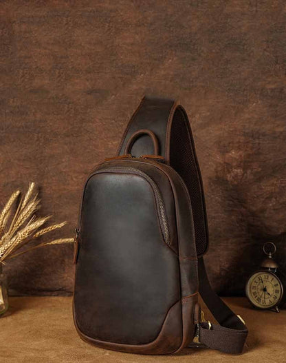 Vintage Casual Leather Men's Chest Bag displayed on a textured background with wheat stalks and a vintage clock.