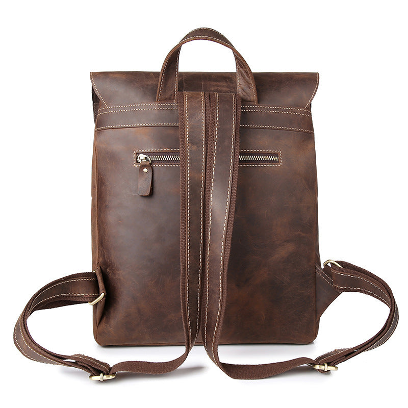 Rugged brown leather backpack with multiple pockets and zippers for convenient storage. Durable and stylish design suitable for everyday use or travel.