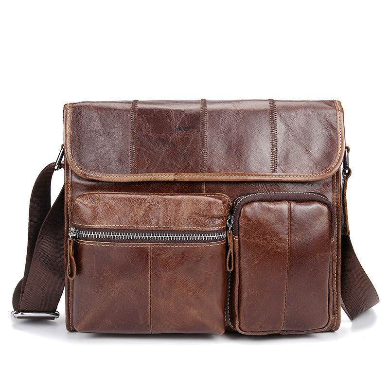 Vintage leather satchel bag with multiple pockets and a flap closure, designed for men's casual and leisure wear.