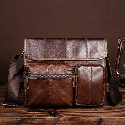 Vintage leather satchel bag with multiple pockets and compartments, ideal for a stylish and practical men's casual accessory.