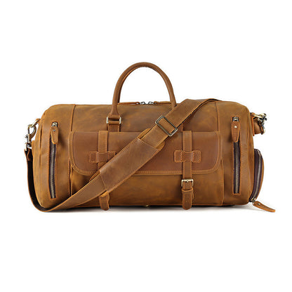 Rugged and vintage-inspired Crazy Horse leather travel bag with large capacity, featuring multiple zippered compartments and a removable shoulder strap for versatile carrying options.