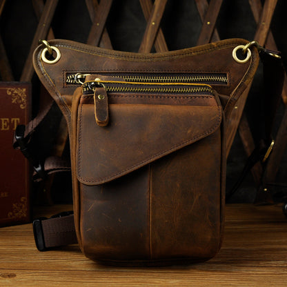 Rugged leather waist bag with multiple zippered compartments, designed for versatile storage and convenience.