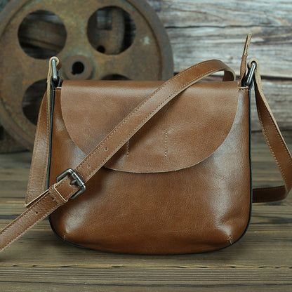 Retro simple leather crossbody bag for women, subtle brown tones, durable leather construction, stylish and functional design.