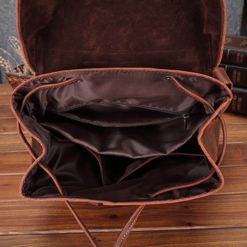 Spacious leather travel bag for men. Sturdy brown leather exterior with ample storage compartments for convenient organization during travel. Designed for maximum capacity and functionality, making it an ideal companion for leisure trips and adventures.