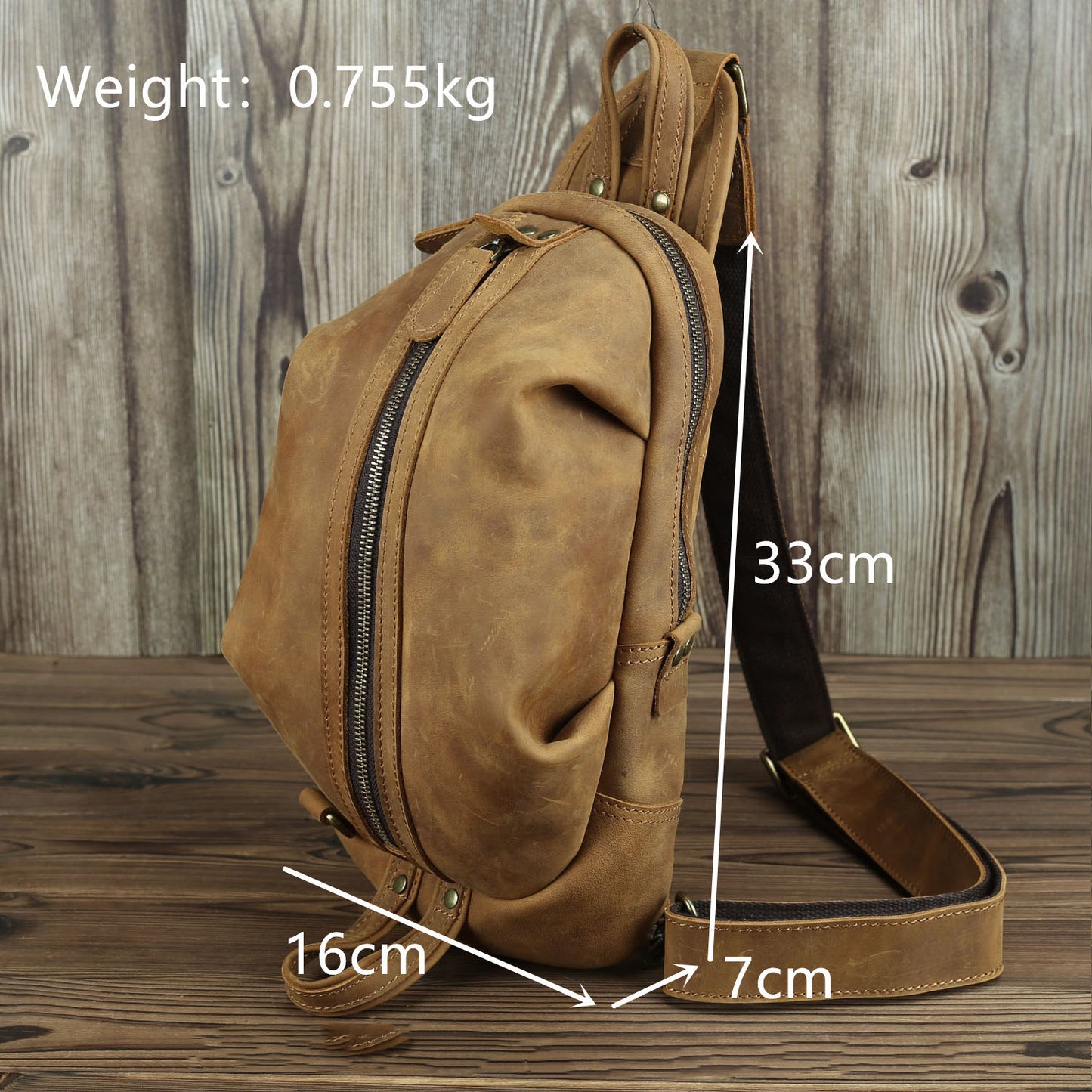 Leather chest bag with large capacity on rustic wooden background