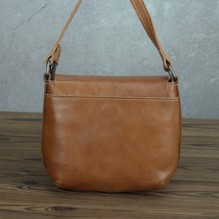 Retro simple leather crossbody bag for women, featured in the image, with a sleek tan color and durable leather construction designed for style and functionality.